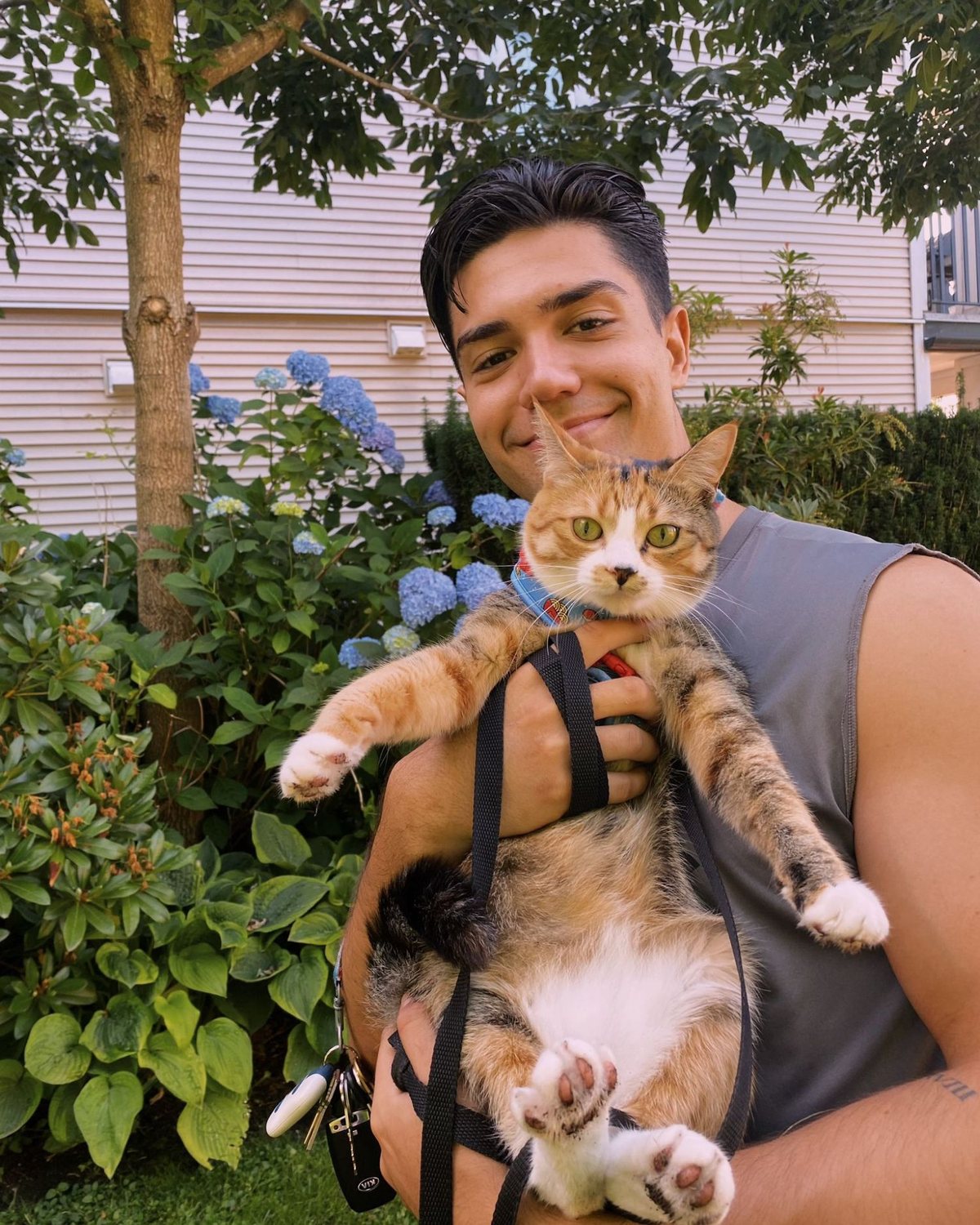 Daniel holding one of his cats